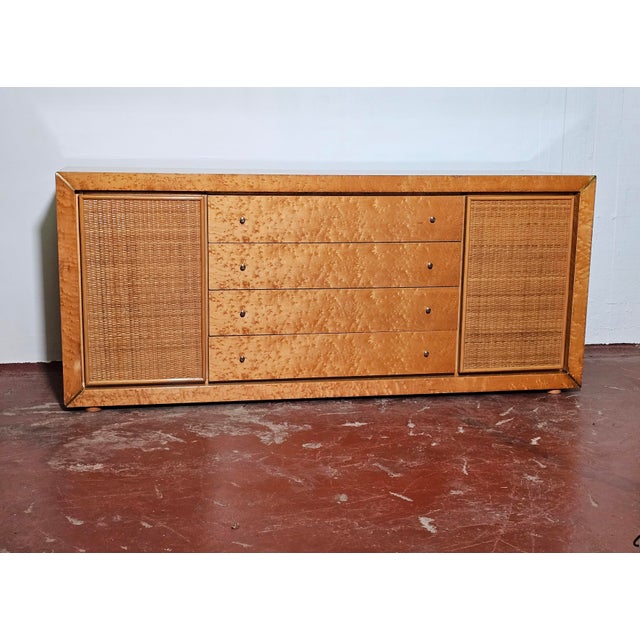 A unique sideboard dating back to the late 1970s, attributed to "Vivai Del Sud." Maple veneered wood frame, bamboo and...