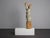 An expressive carved wooden sculpture of a female figure by australian-dutch artist tom de munk-kerkmeer, created in 1990....