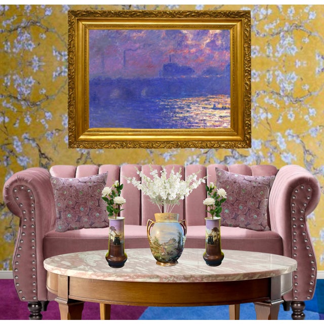 The centerpiece of this elegant trio of antique porcelain vases is a richly detailed work that captures the charm of an...