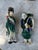 A decorative pair of vintage ceramic figural wall pockets depicting figures in traditional Asian dress. Each piece...