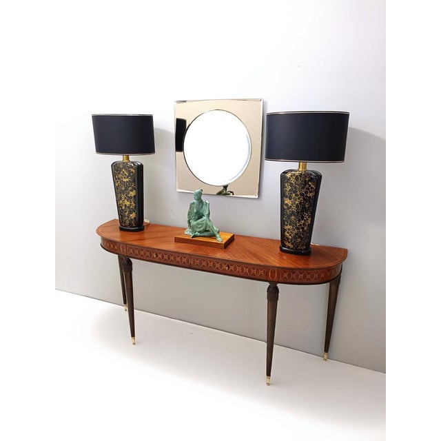 Made in Italy, 1980s. These table lamps are made in black and gold glazed ceramic and brass. They are vintage items,...