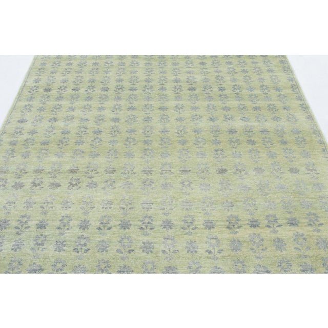 Hand-knotted in a luxurious blend of wool and silk, this 6x6 square rug is a serene and sophisticated addition to the Rug...