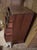 Solid wood, mahogany (dark auburn) chest of drawers with five drawers. Makers tag on inside top drawer. Made by Colonial...