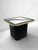 Striking vintage postmodern side table dating to 1994, featuring a square smoked glass top with a bold black graphic...