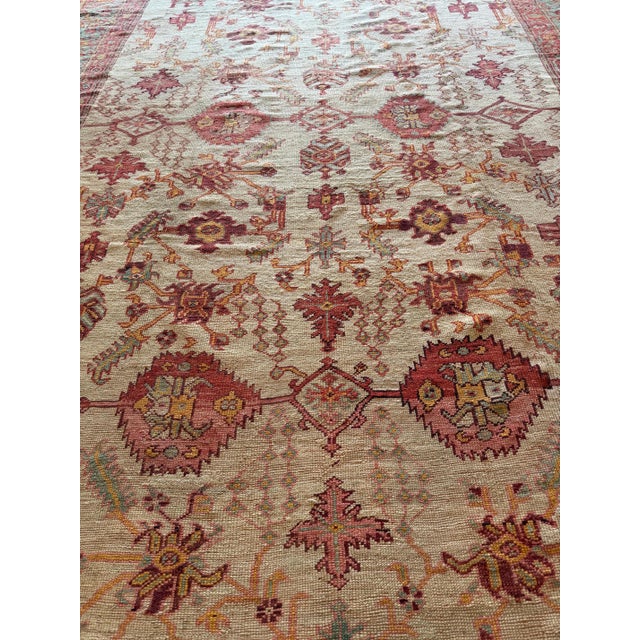 This exceptional late 19th century Oushak carpet embodies the timeless elegance and understated grandeur that has made...