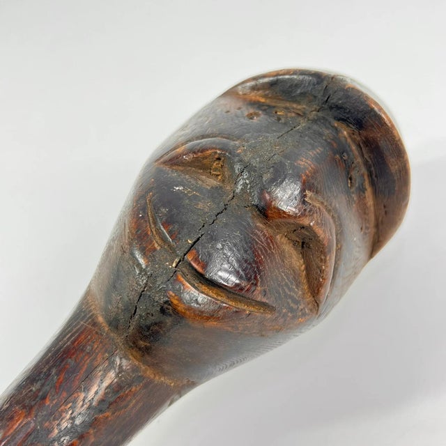 A Dinka cattle scepter is a carved wooden staff associated with the pastoral traditions of the Dinka people of South...