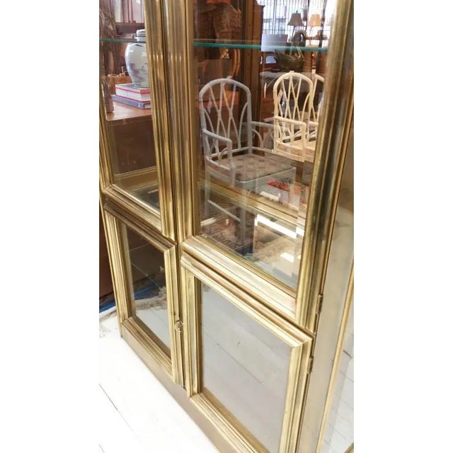 Absolutely gorgeous Mastercraft vitrine that is a stunning brass masterpiece! This Hollywood Regency piece will add such a...