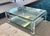 Two-Tier Lucite and Glass Coffee Table. Featuring 3/4" thick glass and thick lucite legs. Excellent pre-owned condition...