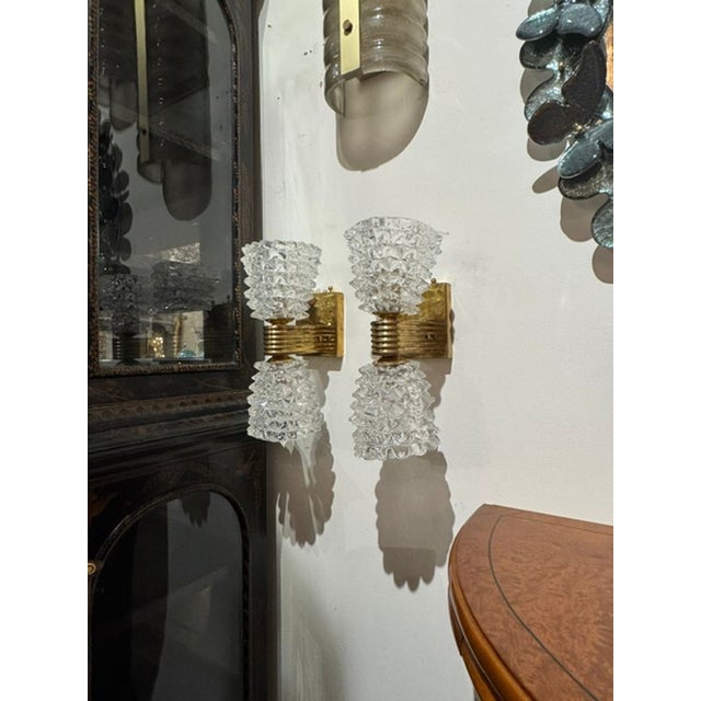 The Pair of Murano Rostrada Sconces is a set of two lighting fixtures originating from Murano, known for its glass-making...