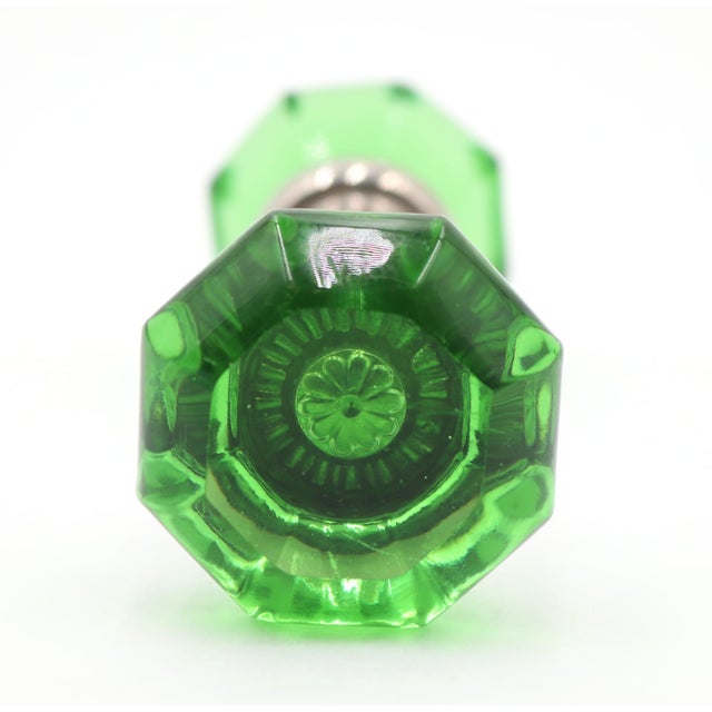 Vintage octagon shaped green glass door knobs with a nickel plated brass shank. Priced as a pair of knobs with a spindle....