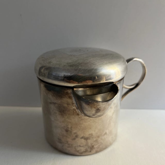Marvelous 1930s silver plated baby's cup with handle and lid made in Mexico.. Sippy cup with handle. Marked Made in Mexico...