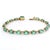 A refined 18 karat yellow gold bracelet set with sixteen richly saturated Colombian emeralds totaling approximately 8.15...