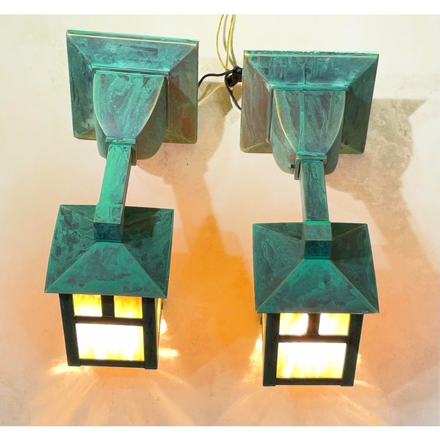Elevate the exterior of your home with this elegant matching pair of Mission-style outdoor lanterns. These fixtures...