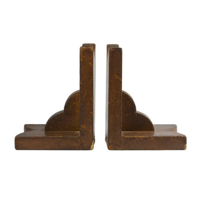 Pair of mid-20th century Modern leather-covered wood bookends by the luxury brand Hermès Paris, France By: Hermès Paris...