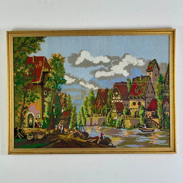 A joyful scene for this beautiful and colorful needlepoint depicting a village scene of old, all taking place by the...