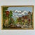 A joyful scene for this beautiful and colorful needlepoint depicting a village scene of old, all taking place by the...