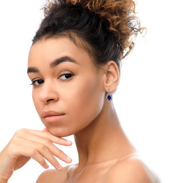 These elegant diamond accent and gemstone stud earrings boast a glorious sense of style! Set in .925 sterling silver, a...