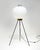 A sculptural floor lamp defined by its architectural presence and balanced proportions, reflecting the disciplined...