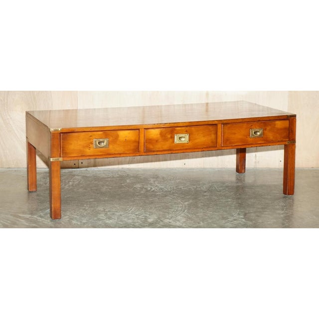 Vintage collectable Burr Yew wood and Brass restored Military Campaign three drawer coffee table This piece was retailed...