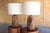 A pair of studio-craft solid cedar wood table lamps. Both newly rewired with custom shades in Belgian linen. They both...