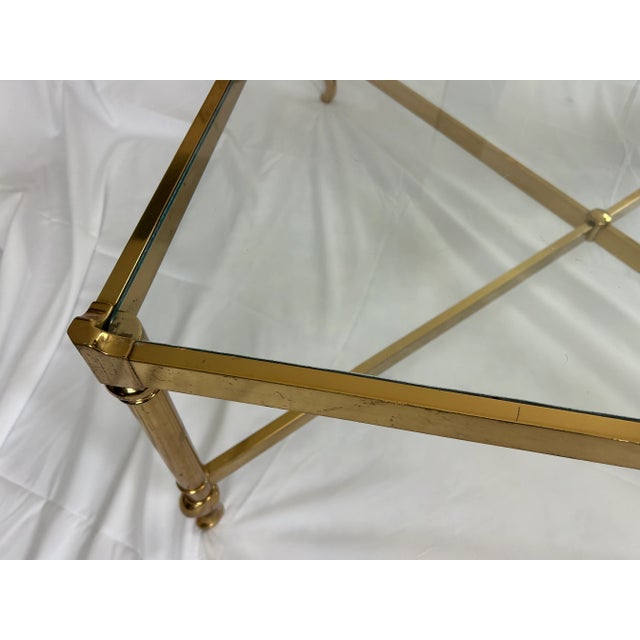 A breathtaking brass coffee table crafted by the esteemed Italian maker, Solmet. This exquisite piece showcases a sleek...