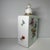 Lovely vintage French floral flask with lid. White porcelain with floral and gold decorations on all sides and top.
