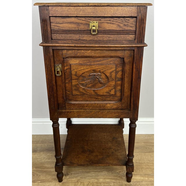 Bring classic French character to your home with this Antique French Oak bedside table . Featuring beautifully carved...