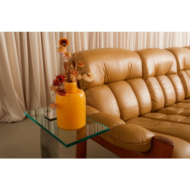 Norway looked at the sofa and decided it wasn't doing enough. The result was the Montana: a solid teak frame, clean...