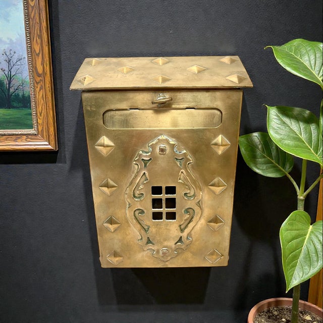 Lovely and unique vintage or antique wall-mount letterbox made of solid brass. It is rectangular in shape with a slanted...