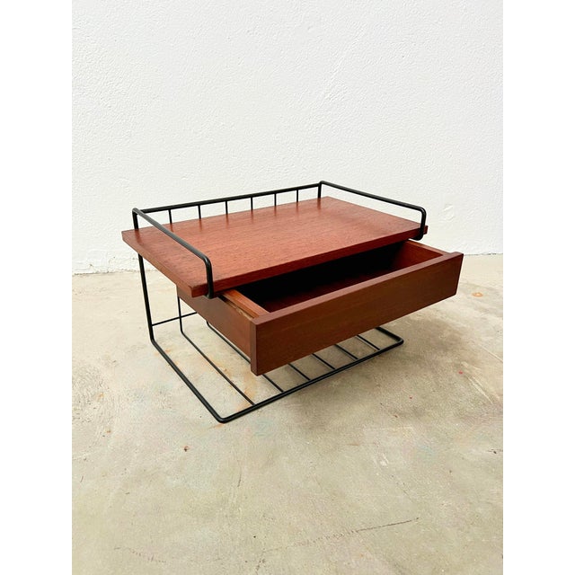 This small shelf makes a perfect bedside table with its drawer and metal shelf. You can fix it to the wall with screws or...