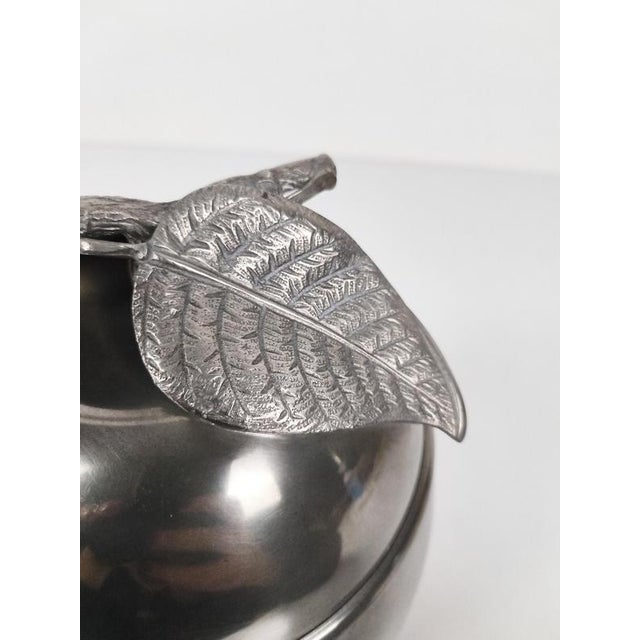 This is a pewter ice bucket with silvered details, shaped like a charming apple. Made in Italy and hand-finished, as...