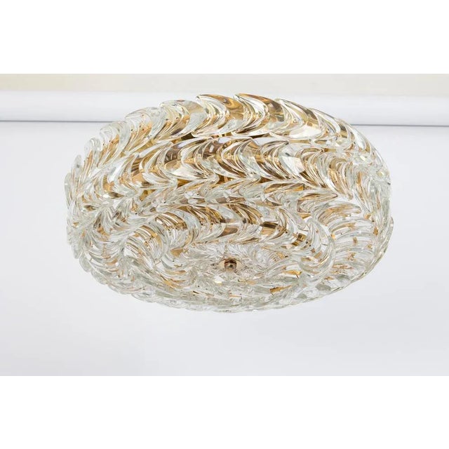 Delicate floral chandelier with crystal glass and brass parts made by palwa, germany, 1970s. Featuring a multitude of...