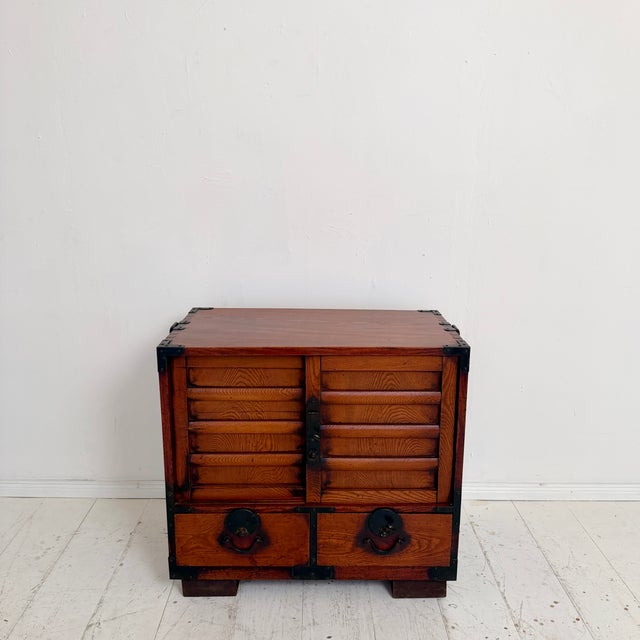 This early 20th century Japanese Choba Tansu is a beautiful example of traditional Japanese merchant furniture, combining...