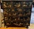 A George III Japanese chinoiserie painted chest of drawers with gilt and polychrome scenes. Circa 1760 - 1820. Replaced feet.