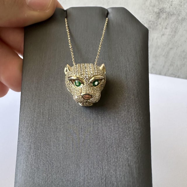 Make a fierce statement with this stunning Diamond & Emerald Panther Head Necklace, crafted in luxurious 14kt Yellow Gold....