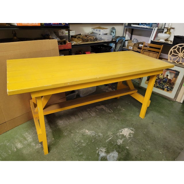 Unique yellow painted heavy duty work bench made from large beams. Hand crafted in the 70's and in good condition. Great...