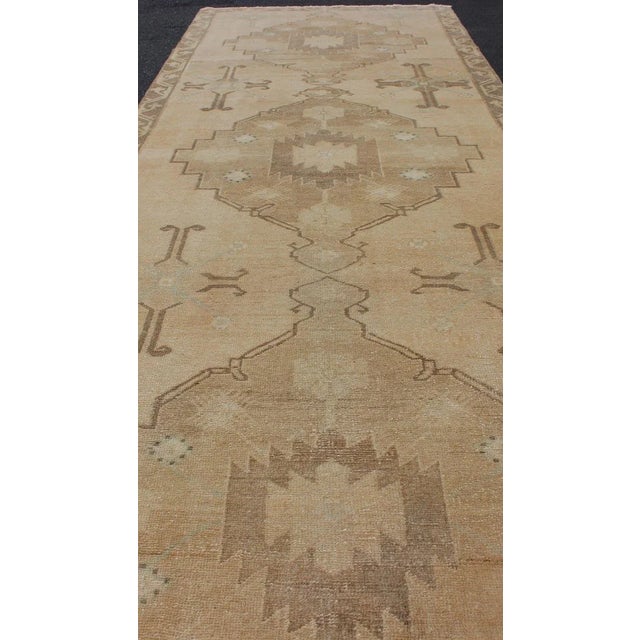 Textile Vintage Turkish Oushak Runner Neutral and Warm Colors With Tribal Medallions For Sale - Image 7 of 13