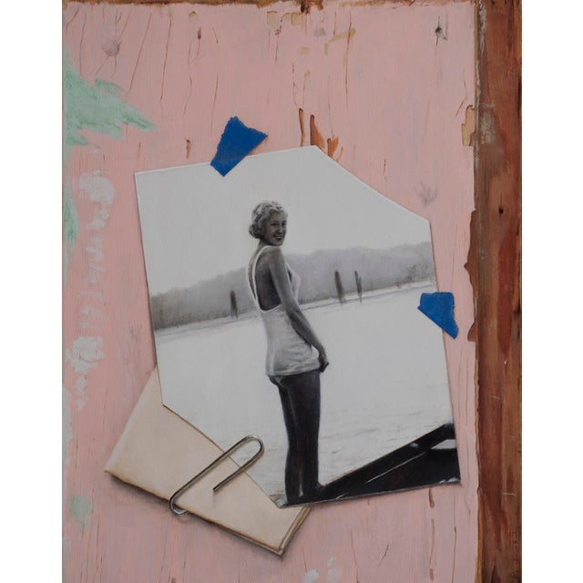 This artwork features a vintage black-and-white photograph of a woman standing by the water, set against a textured,...