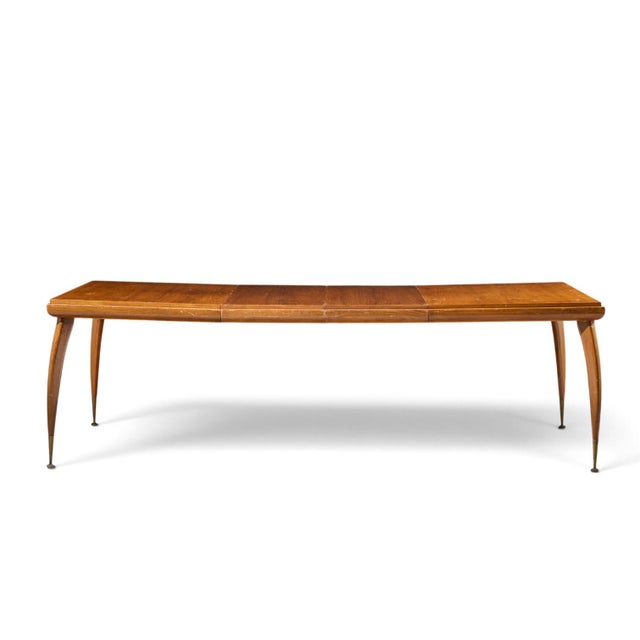 Gio Ponti Style Mid Century Italian Walnut and Brass Expanding Dining Table with 2 Leaves This table measures: 61 wide x...