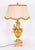 A superb and decorative Neoclassical Revival antique pair of ormolu urns, later wired into table lamps, dating from the...