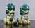 Acquired at a US estate sale, these porcelain Chinese foo dogs date from the 1960s. Dogs are glazed in green and yellow...