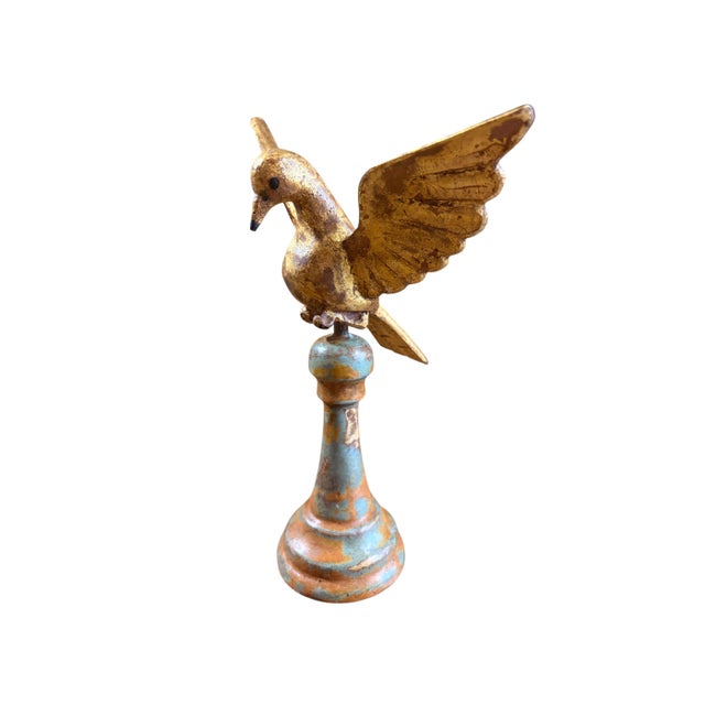 Add a playful touch to your space with this unique European hand-carved wood bird sculpture. Standing majestically on a...
