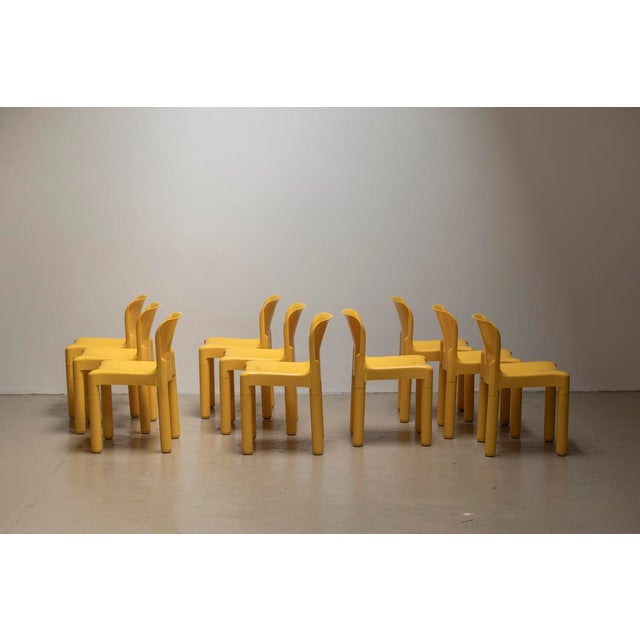 Set of 10 chairs ‘model 4875’ designed by Carlo Bartoli and produced by Kartell around 1970. These deep yellow chairs are...