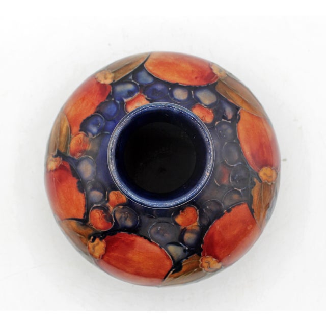 Circa 1930s low vase by Moorcroft, "Pomegranate" pattern, England. The acclaimed Pomegranate pattern by William Moorcroft,...