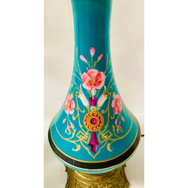 Antique pair of napoleon iii oil lamps gilt bronze base and neck porcelain lamp with floral decoration on a blue...