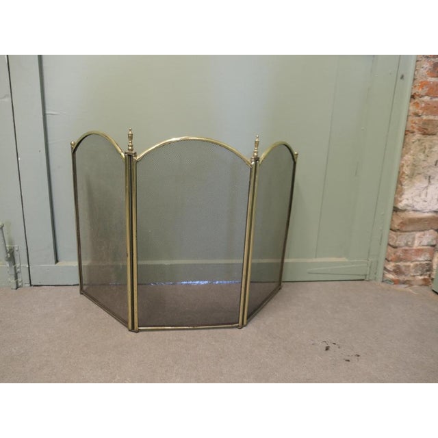 Folding Brass and Iron Fire Guard This very useful spark guard has a 3 fold brass frame and a fine black mesh infill...