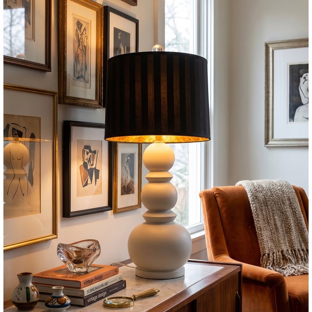 The large scale ceramic table lamp featured here sits at the intersection of Postmodern and Hollywood Regency. The...