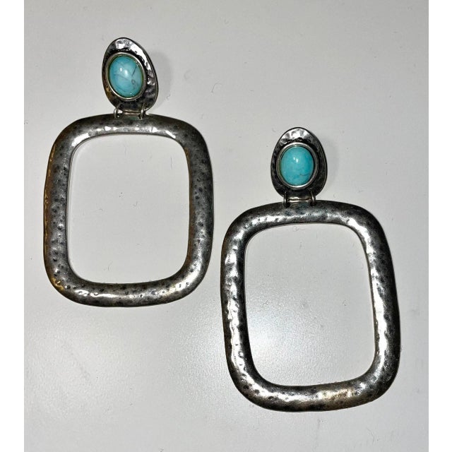 This is part of Chairish’s Costume Jewelry assortment. This massive oversized Navajo earrings are made with Silver Alloy...