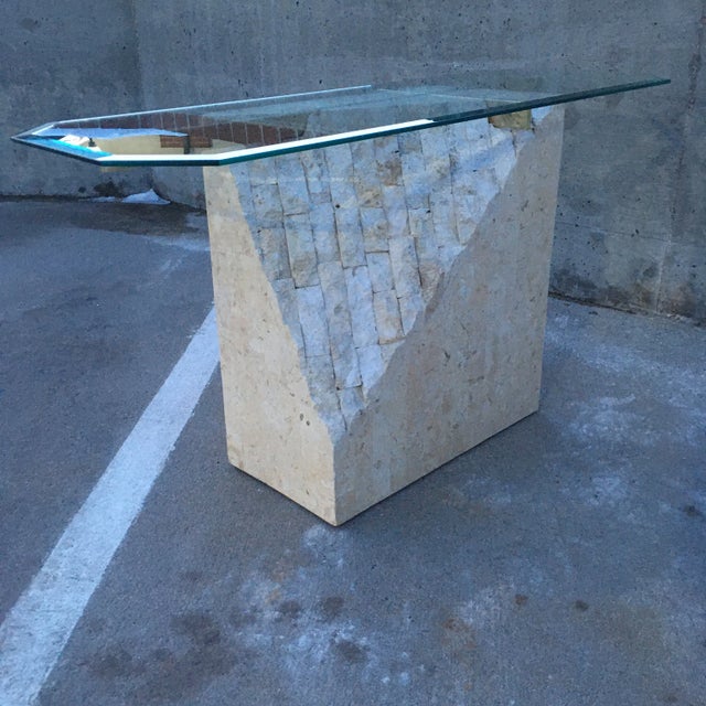 Large console sofa table with beveled octagonal glass top, brass x-support, atop smooth polished and rough cut tessellated...