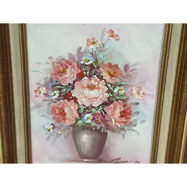 Apair of oil on canvas-floral scenes, signed-with matching wooden frames One is signed-T. Kelly The other Robert Cox Both...